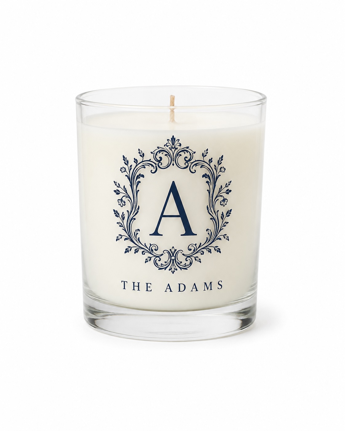 A monogrammed candle on a clean white background, marketplace-ready